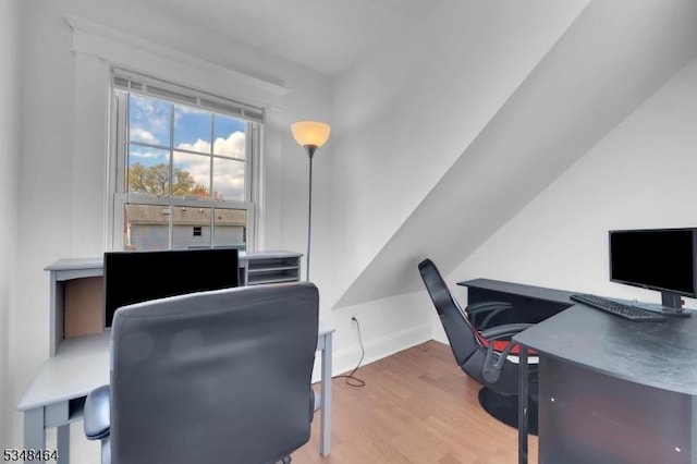 office area with baseboards and wood finished floors