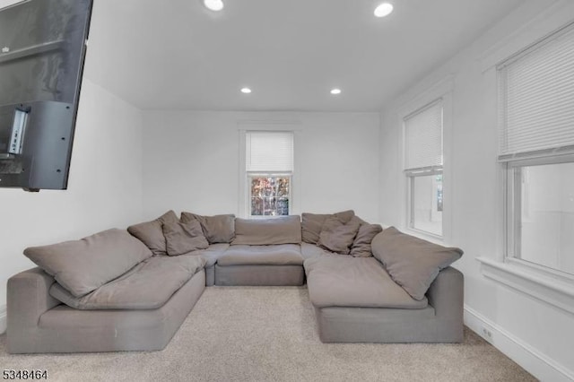 living room with baseboards, carpet flooring, and recessed lighting