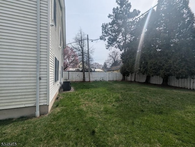 view of yard featuring central AC unit