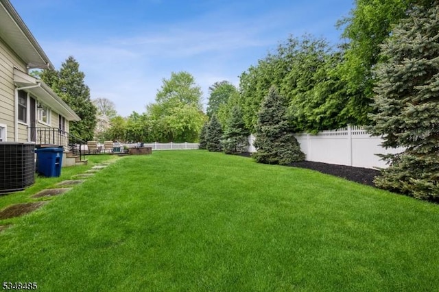 view of yard featuring central AC unit