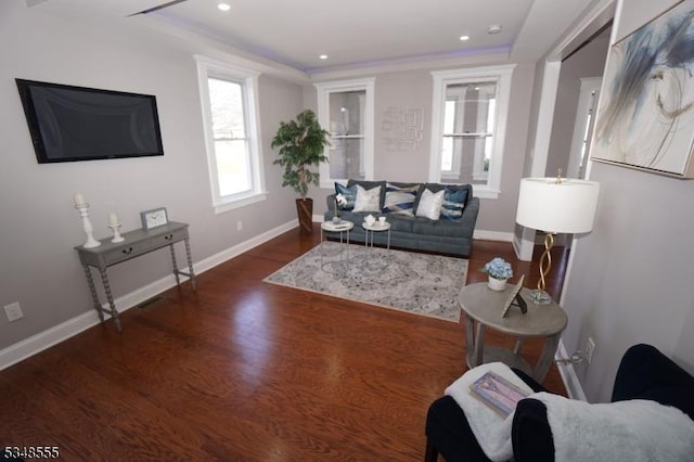 living room with baseboards, recessed lighting, and wood finished floors