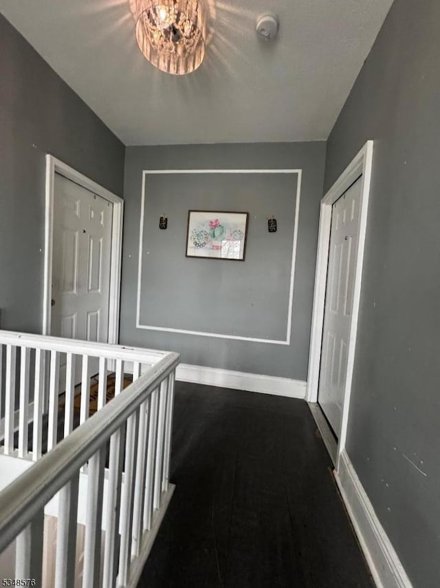 corridor featuring baseboards