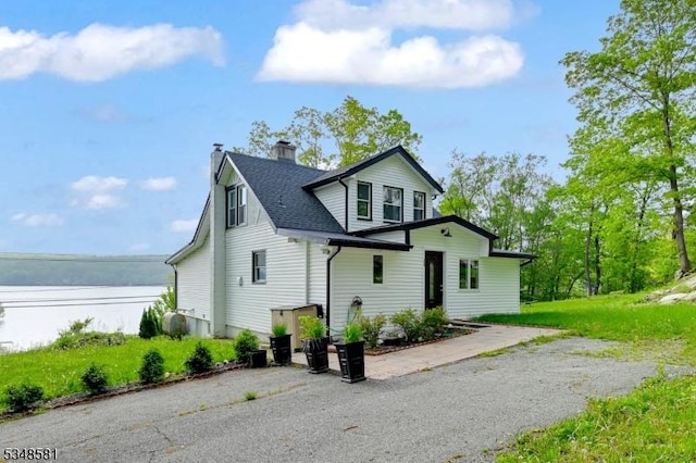 677 Warwick Tpke, West Milford Twp, NJ 07421 - view of side of home featuring a chimney