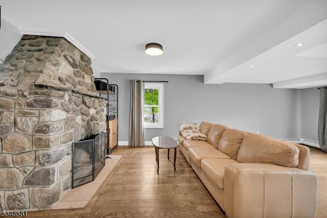 677 Warwick Tpke, West Milford Twp, NJ 07421 - living room with light wood-style flooring, baseboards, a stone fireplace, and recessed lighting