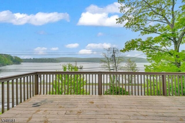 677 Warwick Tpke, West Milford Twp, NJ 07421 - wooden terrace with a water view