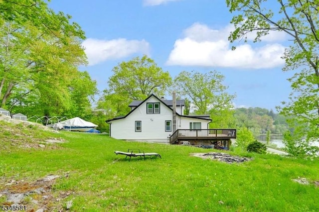 677 Warwick Tpke, West Milford Twp, NJ 07421 - back of property featuring a deck and a yard