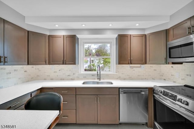 677 Warwick Tpke, West Milford Twp, NJ 07421 - kitchen with appliances with stainless steel finishes, a sink, light countertops, decorative backsplash, and recessed lighting