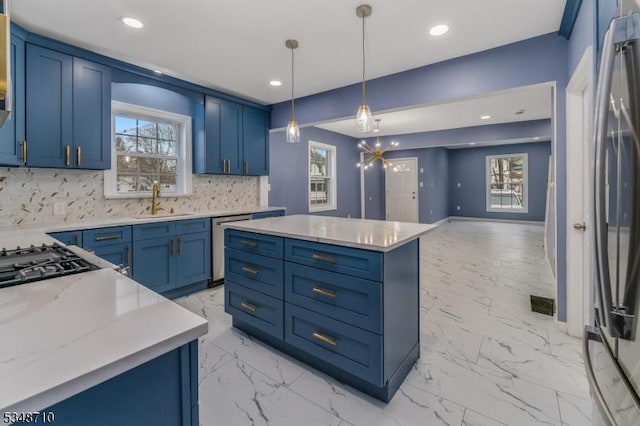 63 S Lincoln Ave, Washington Boro, NJ 07882 - kitchen with marble finish floor, a sink, appliances with stainless steel finishes, decorative backsplash, and blue cabinetry