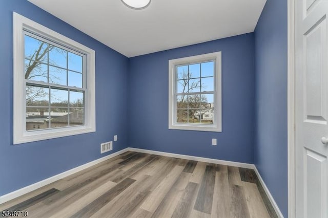 63 S Lincoln Ave, Washington Boro, NJ 07882 - empty room featuring visible vents, baseboards, and wood finished floors