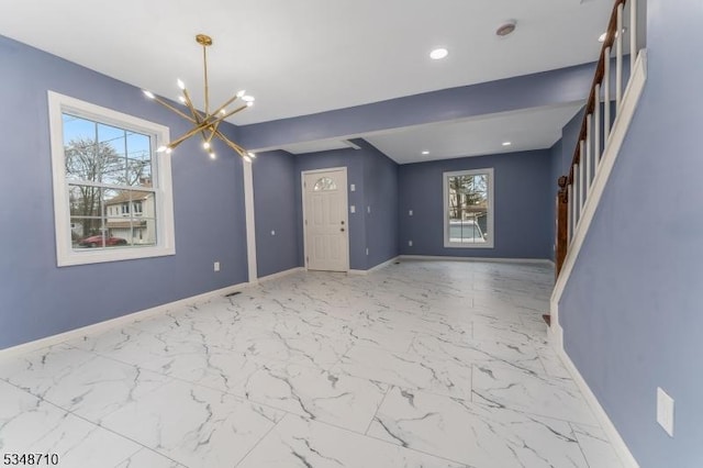 63 S Lincoln Ave, Washington Boro, NJ 07882 - unfurnished living room with an inviting chandelier, recessed lighting, marble finish floor, stairs, and baseboards