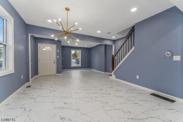 63 S Lincoln Ave, Washington Boro, NJ 07882 - foyer featuring baseboards, a chandelier, stairs, visible vents, and marble finish floor
