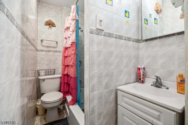 bathroom with toilet, vanity, a shower stall, and tile walls