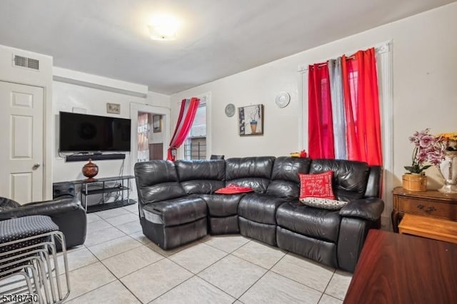 living room with visible vents and light tile patterned flooring