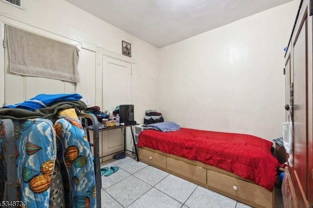 bedroom featuring tile patterned floors and visible vents