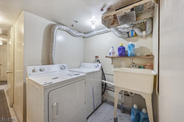 laundry room with washer and clothes dryer and laundry area