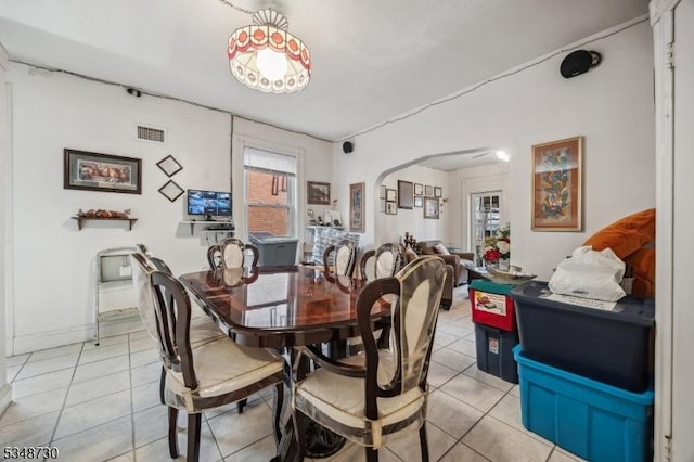 dining room featuring visible vents and light tile patterned flooring