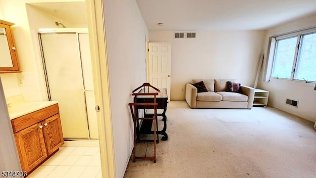 living room featuring light carpet and visible vents
