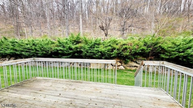 deck featuring a lawn
