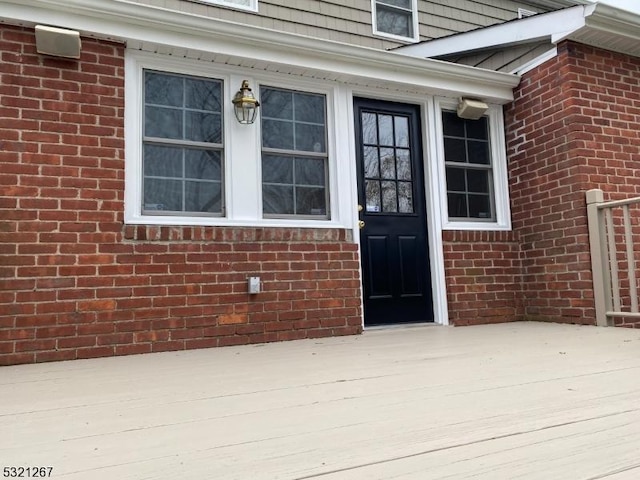 entrance to property with brick siding