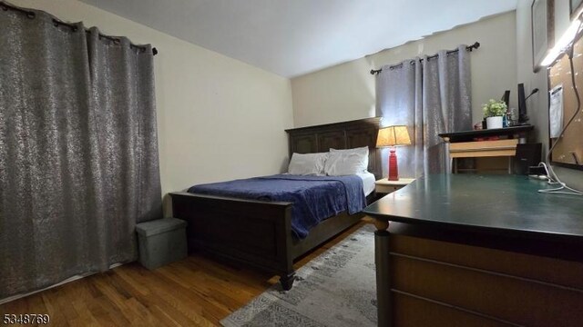 bedroom with wood finished floors