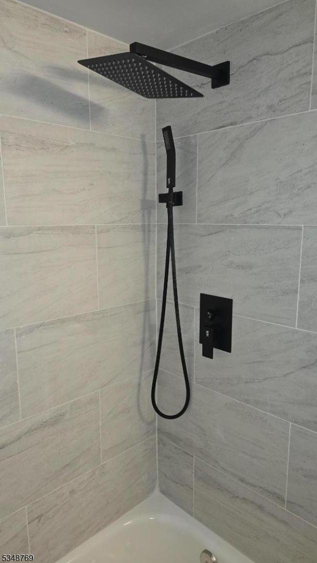 full bathroom with shower / bath combination