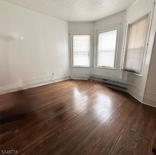237 Warren St, Paterson City, NJ 07524 - spare room featuring wood finished floors and baseboards