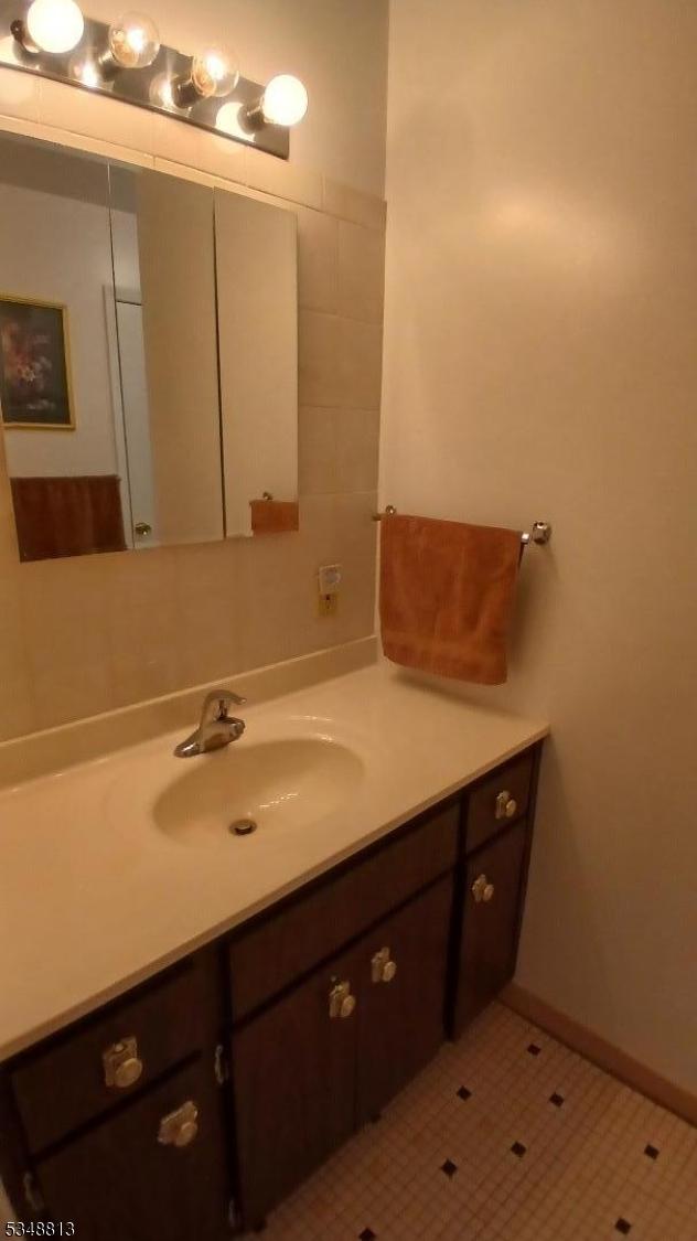 29 King Rd, Franklin Twp, NJ 08873 - bathroom featuring baseboards and vanity
