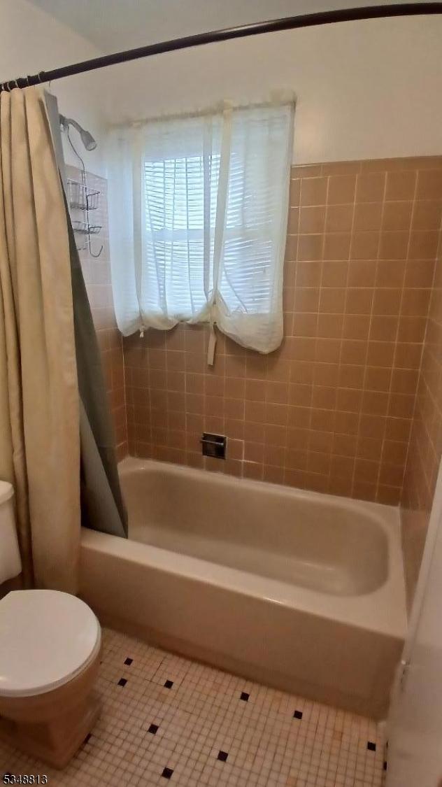 29 King Rd, Franklin Twp, NJ 08873 - full bathroom featuring toilet, tile patterned flooring, and shower / bathtub combination with curtain