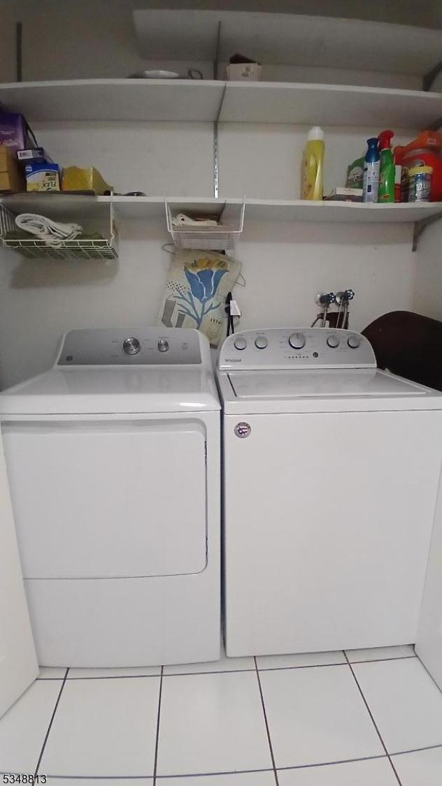 29 King Rd, Franklin Twp, NJ 08873 - laundry area featuring tile patterned floors, washer and clothes dryer, and laundry area