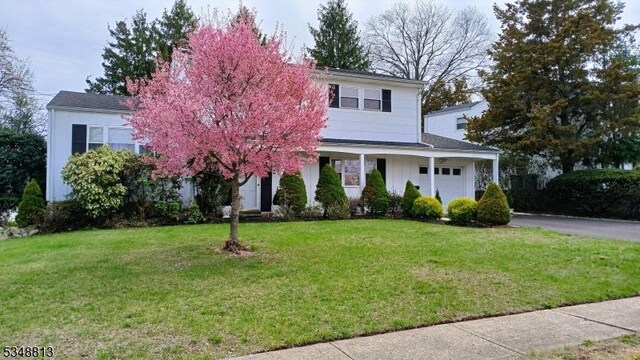 29 King Rd, Franklin Twp, NJ 08873 - view of front of home featuring a front lawn, aphalt driveway, and a garage