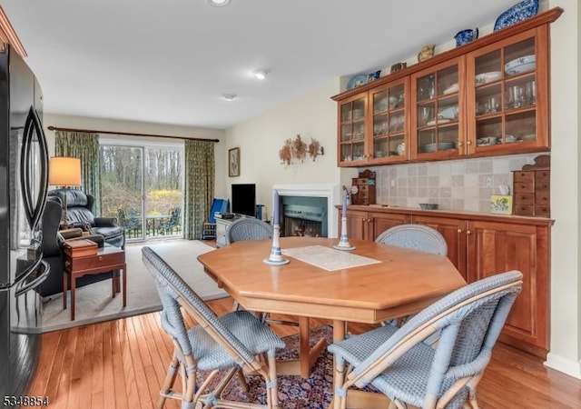 dining room featuring light wood finished floors and recessed lighting