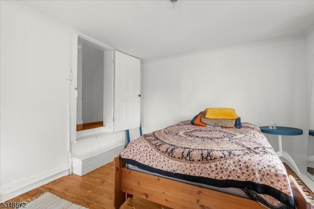97 N Main St, Lambertville City, NJ 08530 - bedroom with ornamental molding, baseboards, and wood finished floors
