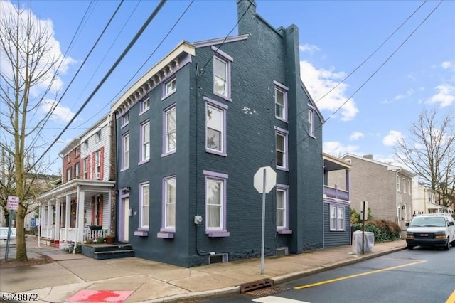 97 N Main St, Lambertville City, NJ 08530 - view of home's exterior with brick siding and a chimney