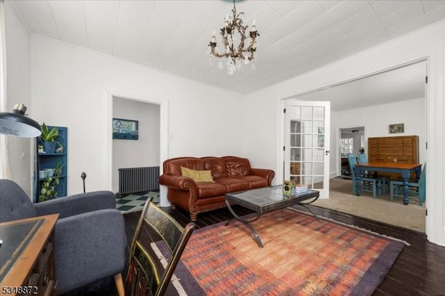 97 N Main St, Lambertville City, NJ 08530 - living room featuring radiator heating unit, an inviting chandelier, and dark wood finished floors