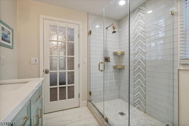 bathroom featuring vanity, recessed lighting, marble finish floor, and a stall shower