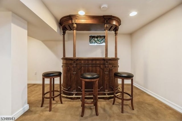 bar with baseboards, recessed lighting, and light colored carpet
