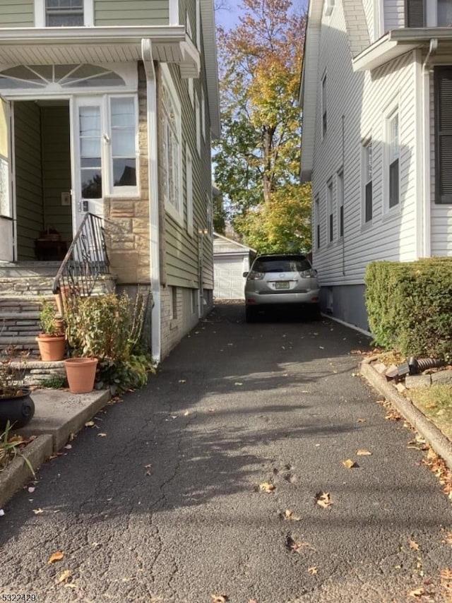 view of home's exterior featuring an outdoor structure