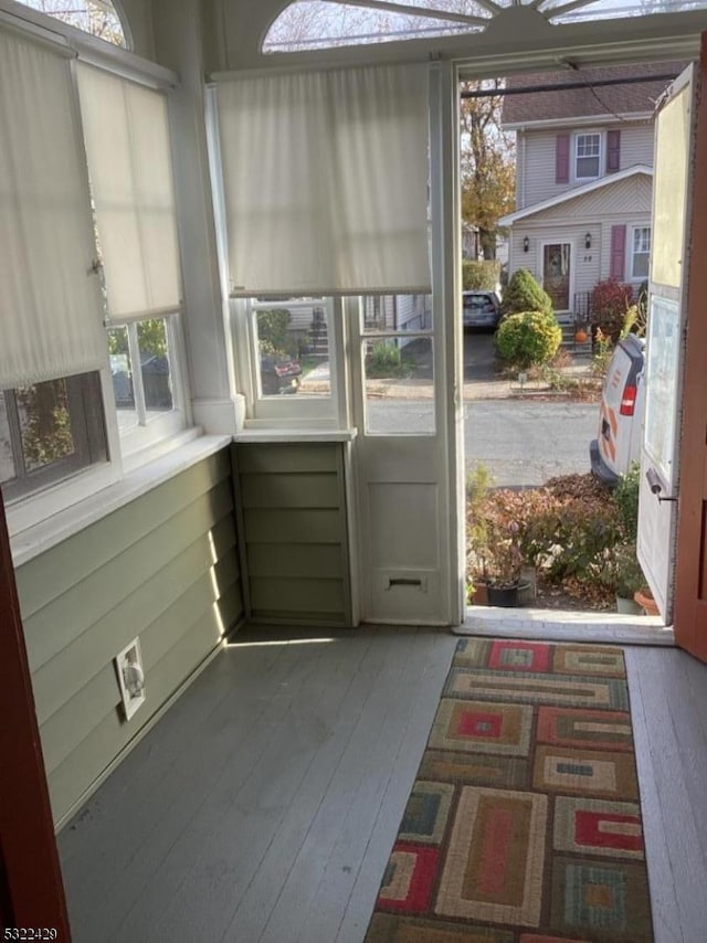 entryway with hardwood / wood-style floors and plenty of natural light