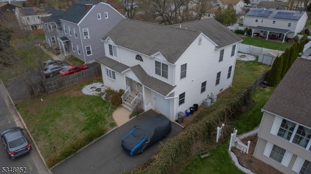 birds eye view of property with a residential view