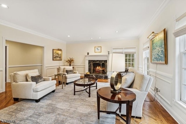 2 Queens Ct, Mendham Twp, NJ 07960 - living room featuring crown molding, a high end fireplace, wood finished floors, a decorative wall, and recessed lighting
