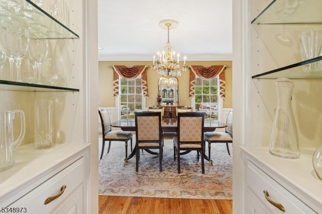 2 Queens Ct, Mendham Twp, NJ 07960 - dining space featuring a chandelier, light wood-style flooring, healthy amount of natural light, and crown molding