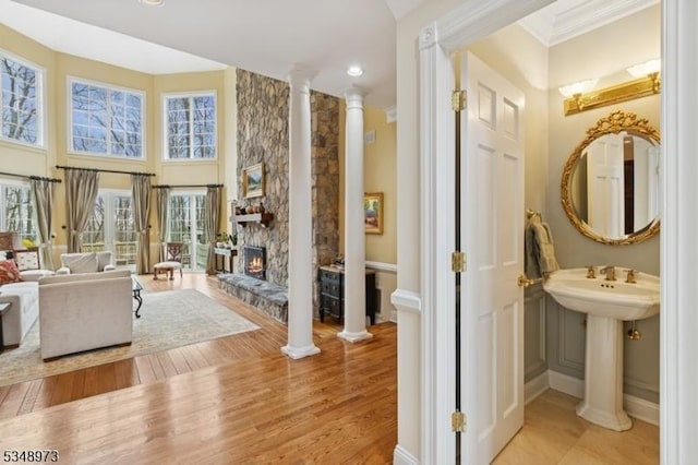 2 Queens Ct, Mendham Twp, NJ 07960 - bathroom featuring ornate columns, a fireplace, wood finished floors, ornamental molding, and recessed lighting