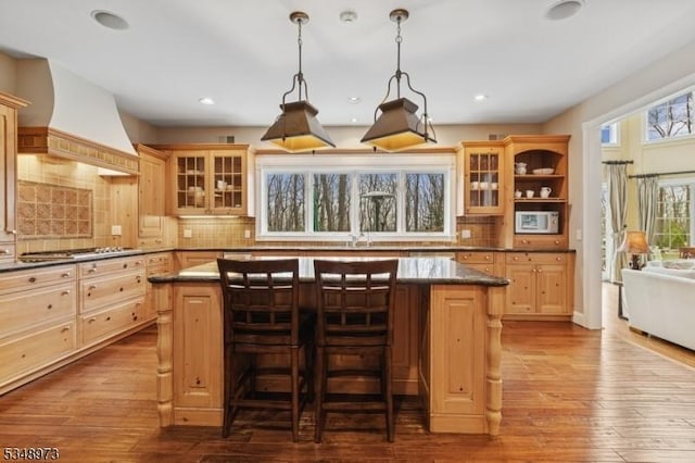 2 Queens Ct, Mendham Twp, NJ 07960 - kitchen with custom range hood, dark countertops, a center island, decorative backsplash, and recessed lighting
