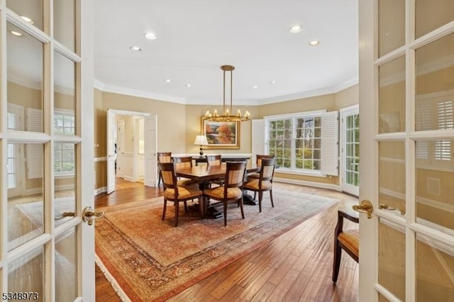 2 Queens Ct, Mendham Twp, NJ 07960 - dining space with ornamental molding, hardwood / wood-style flooring, french doors, a chandelier, and recessed lighting