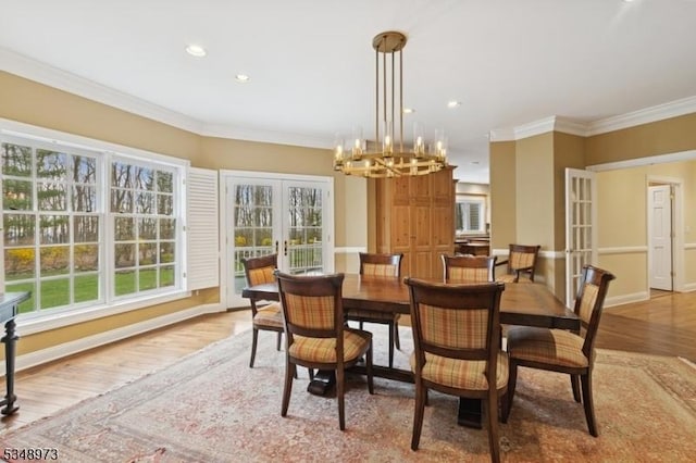 2 Queens Ct, Mendham Twp, NJ 07960 - dining area with french doors, light wood-style floors, a chandelier, crown molding, and recessed lighting