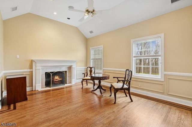 2 Queens Ct, Mendham Twp, NJ 07960 - sitting room with ceiling fan, lofted ceiling, wood finished floors, a wainscoted wall, and a fireplace