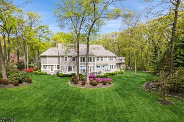 2 Queens Ct, Mendham Twp, NJ 07960 - rear view of house with a lawn
