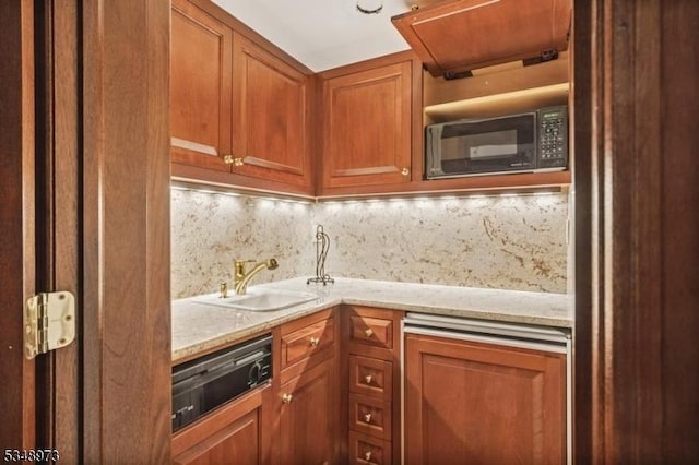 2 Queens Ct, Mendham Twp, NJ 07960 - kitchen with black microwave, decorative backsplash, brown cabinetry, and light stone countertops