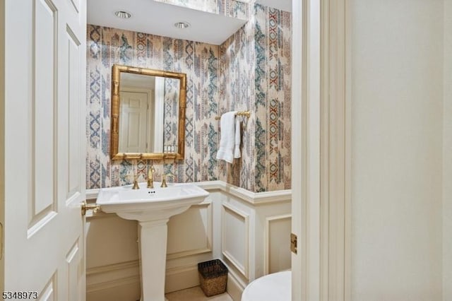 2 Queens Ct, Mendham Twp, NJ 07960 - bathroom with wallpapered walls, a decorative wall, and wainscoting