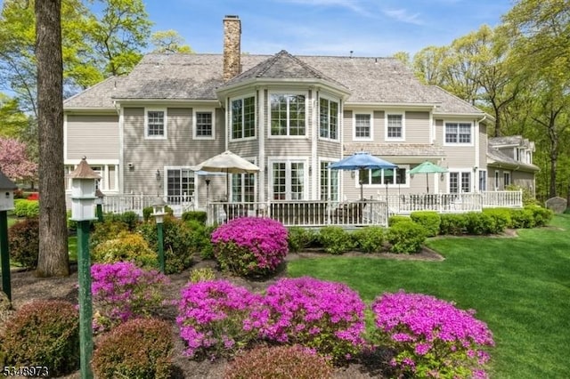 2 Queens Ct, Mendham Twp, NJ 07960 - back of property with a chimney, a wooden deck, and a lawn